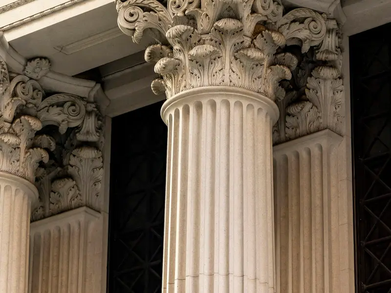 Classical stone columns on a bank facade
